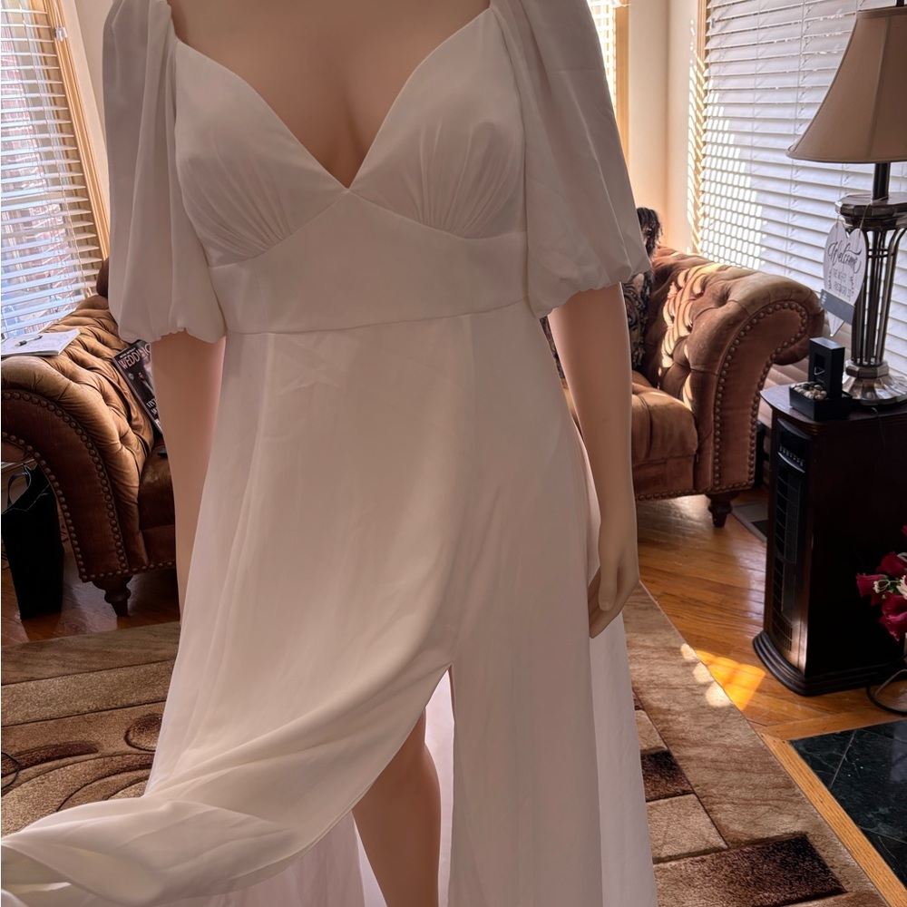 DB STUDIO
Bubble Sleeve Georgette V-Neck Wedding Dress
STYLE# SDWG0971. Size 16w - Picture 12 of 16